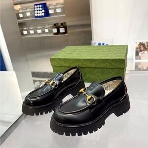 Gucci Black Leather Loafers with Gold Accent